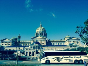 Coach bus in front of the capital.