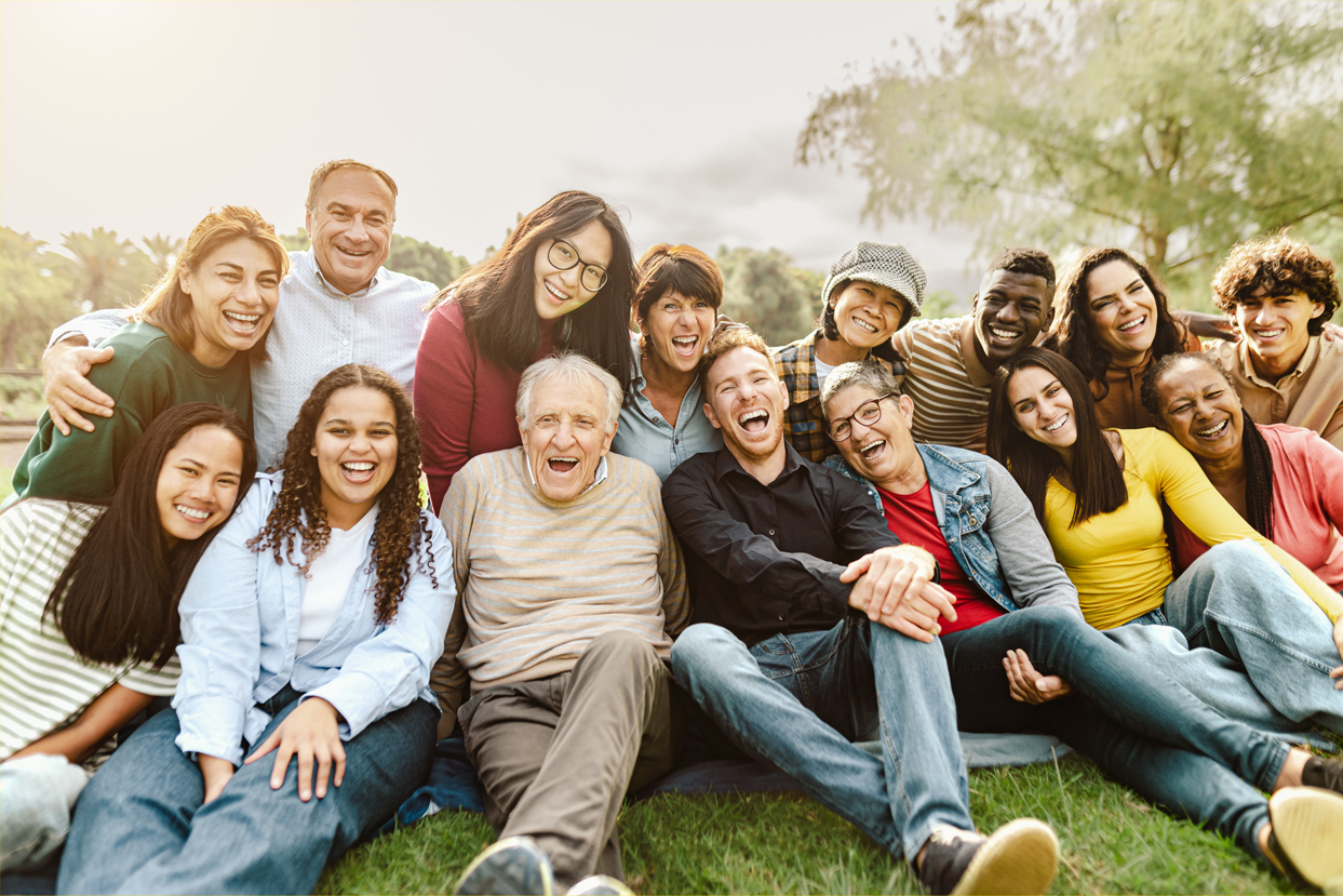 multigenerational family sitting on grass