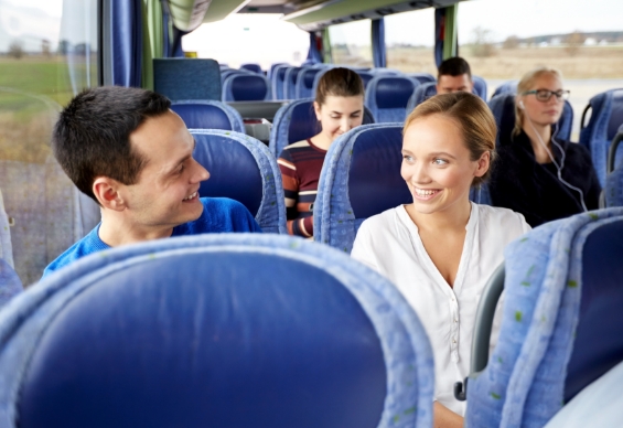 people smiling on a bus