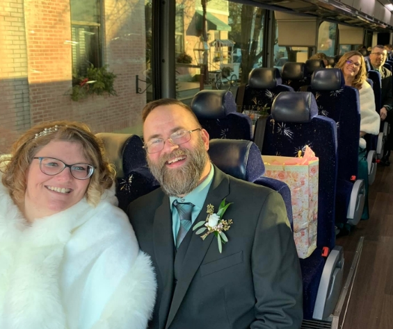 Wedding guests on a coach bus