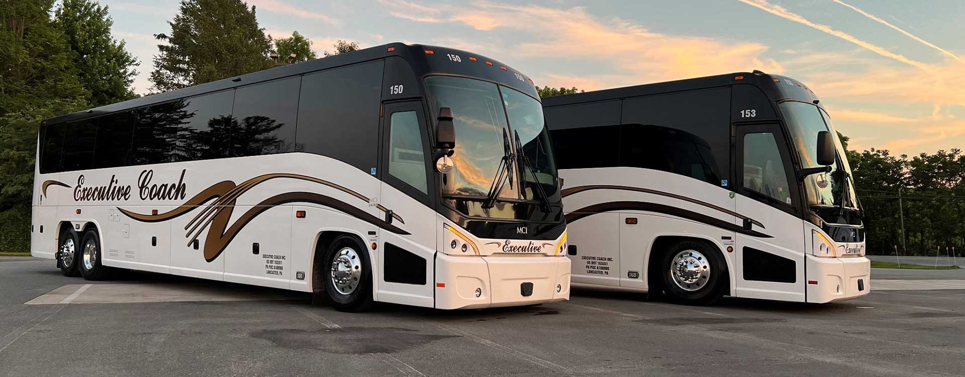 2 Executive Coach buses lined up next to one another